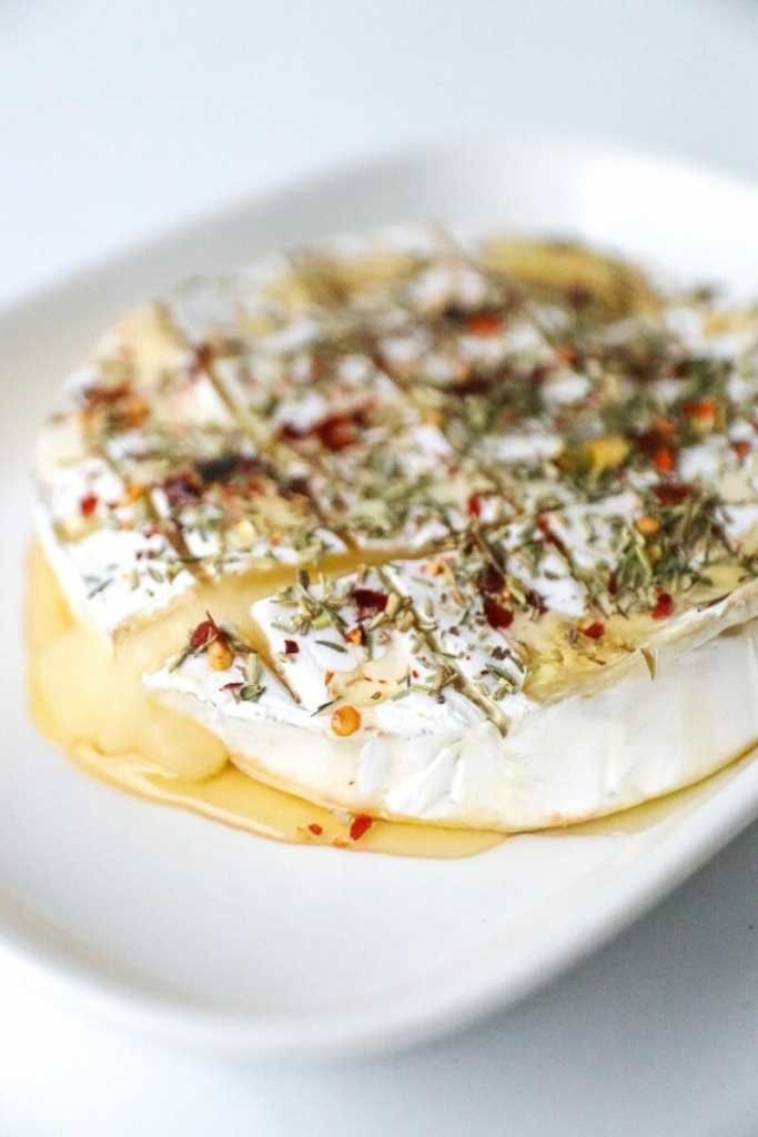 Baked Brie with Cranberries, Pecans, Fig Jam, and Thyme