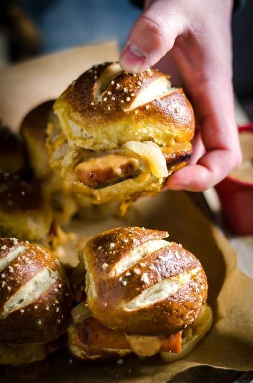 Cheddar Brats on Pretzel Buns