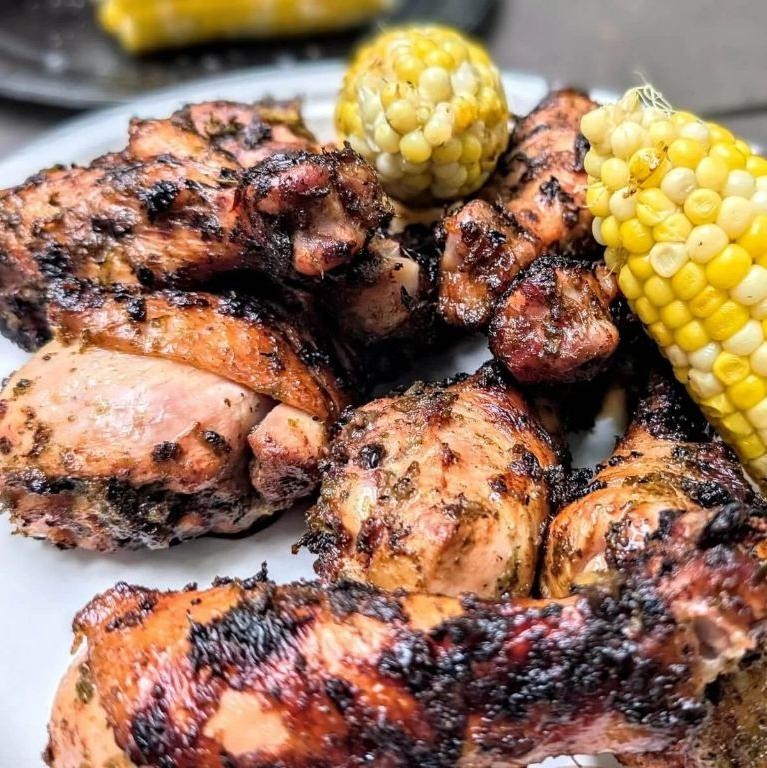 Jerk-Marinated Chicken Thighs with Grilled Corn