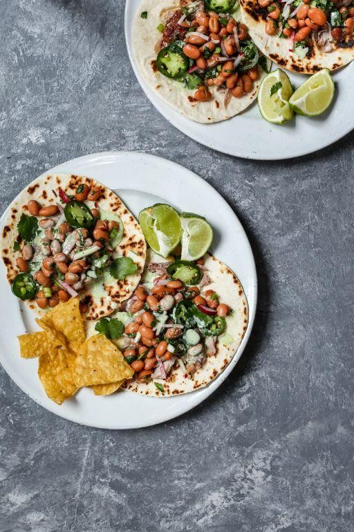 Pork and Pinto Bean Tacos with Lime Crema